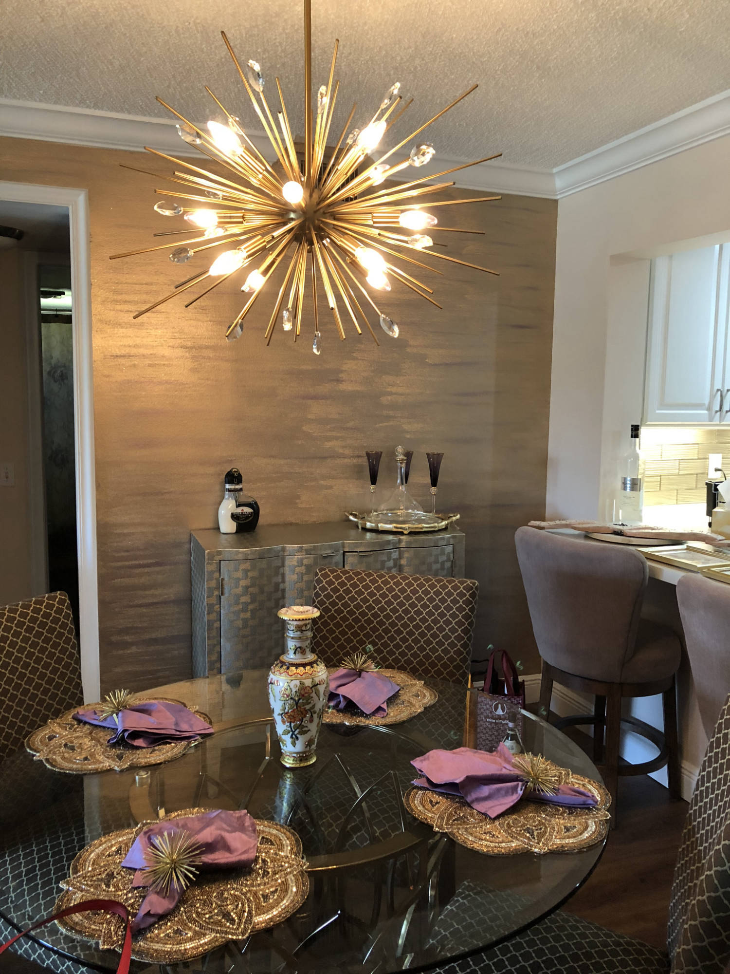 dining room with modern gold chandelier 
