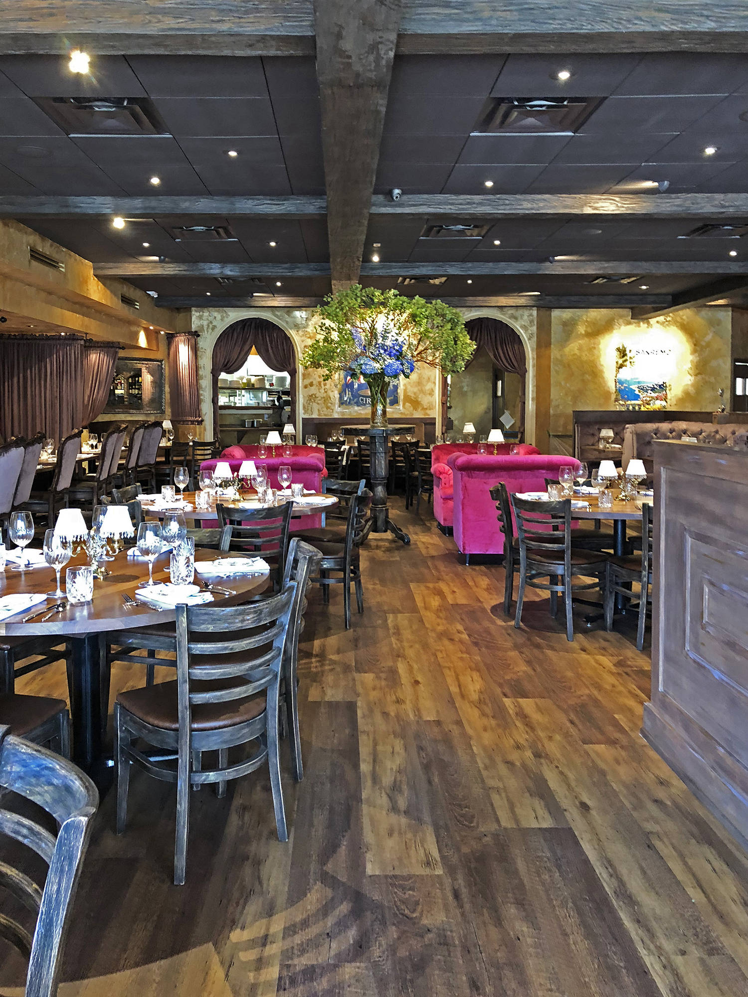 Pazzo Restaurant in Naples with Fuchsia velvet oversized chairs
