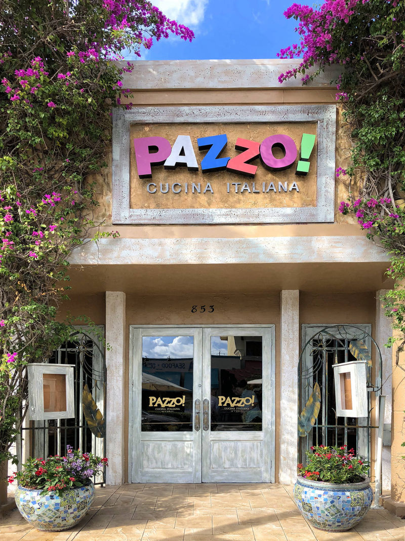 Pazzo restaurant building facade with weathered paint 