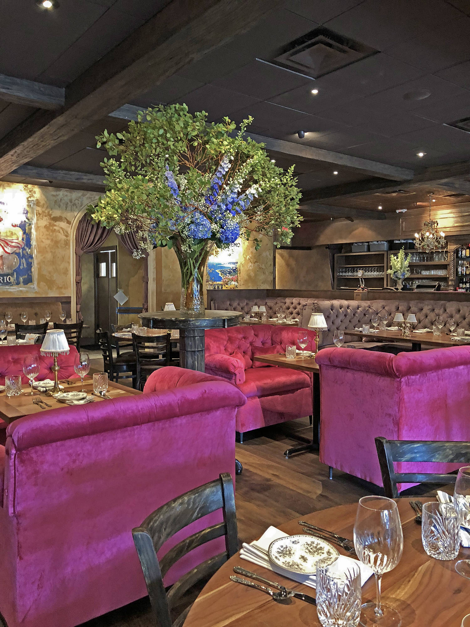 Restaurant interior with tufted velvet chairs 
